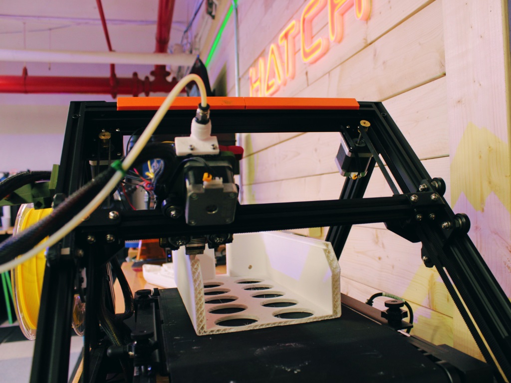 A 3D printer printing a tray
