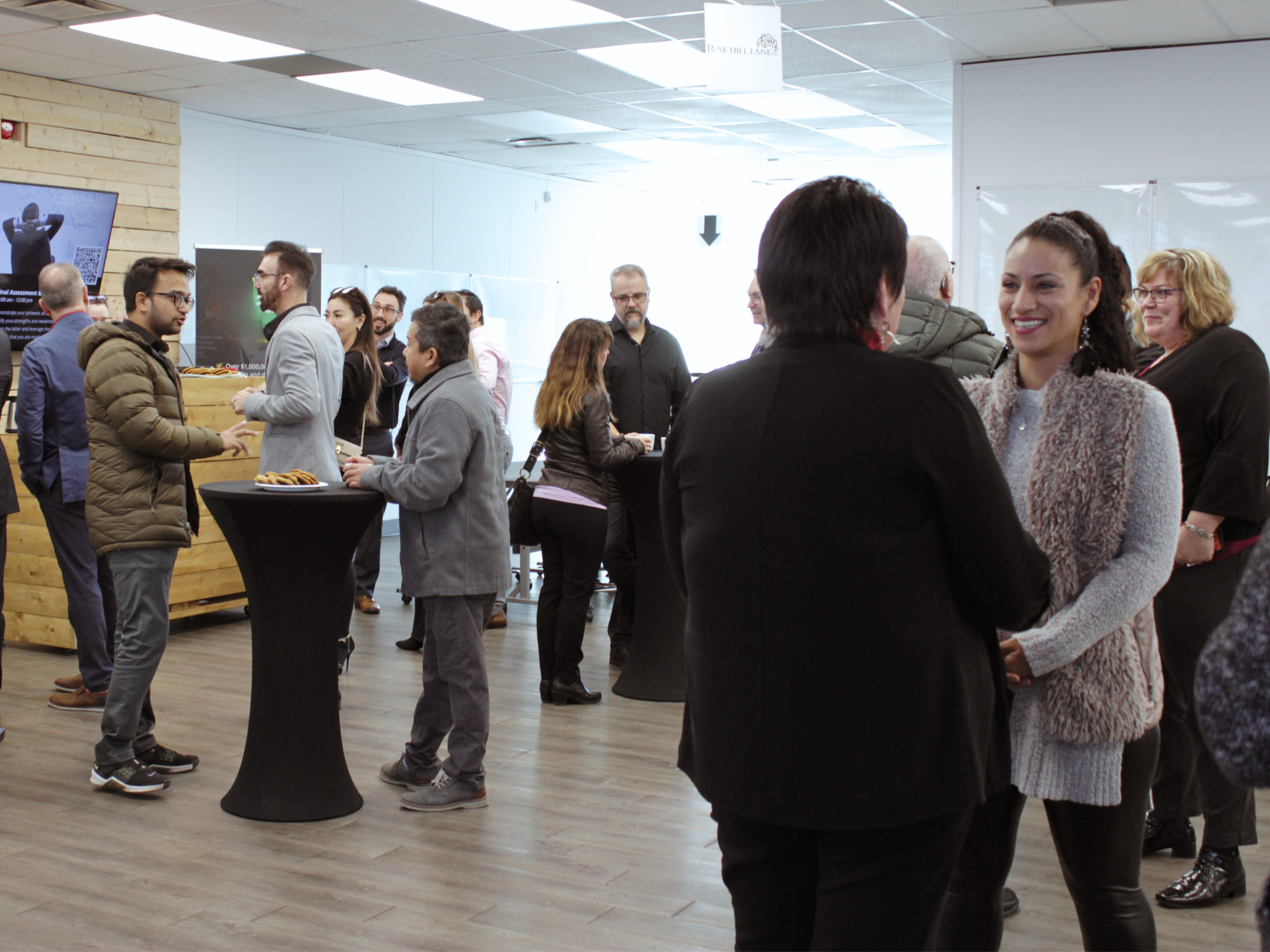 A large group of people networking at the Niagara Falls Innovation Hub