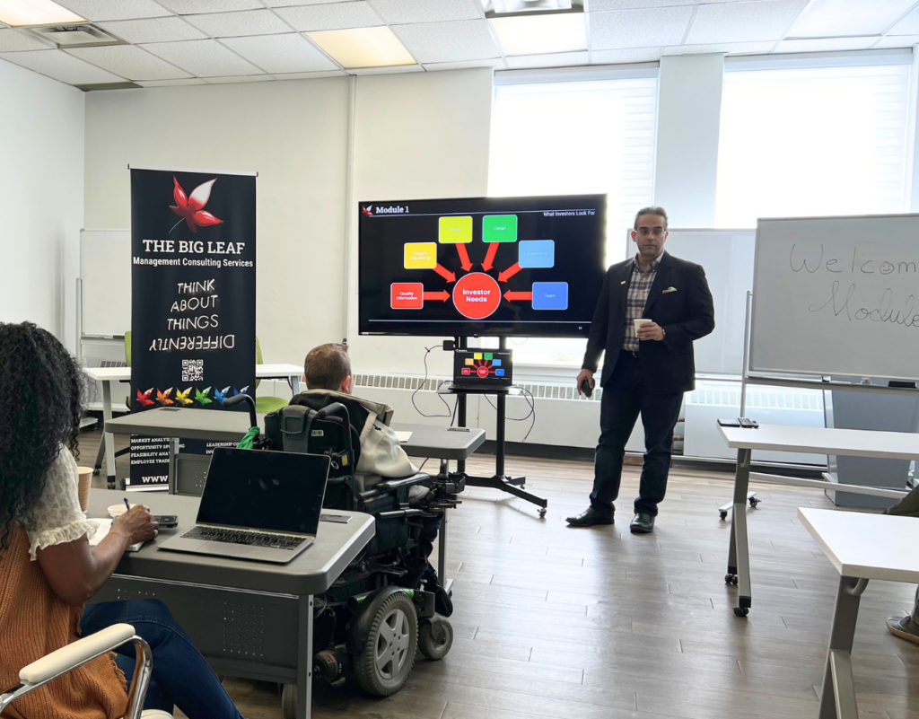 Professor teaching group of new entrepreneurs in a class room at the Niagara Falls Innovation Hub